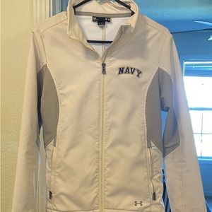 Women’s under armour fitted jacket with navy logo on front.